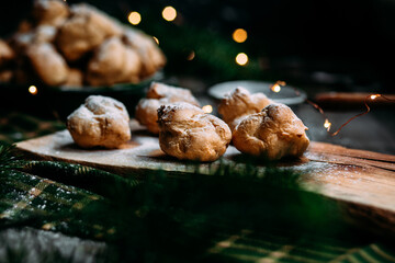 Profiteroles with custard on the table