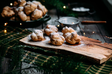 Profiteroles with custard on the table