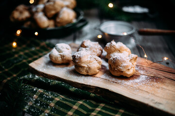 Profiteroles with custard on the table