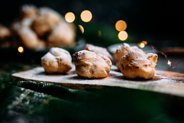 Profiteroles with custard on the table