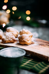 Profiteroles with custard on the table