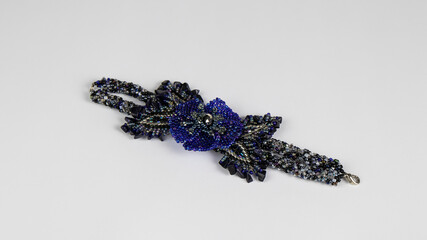isolated women's dark blue bracelet made of crystals and beads on a white background.