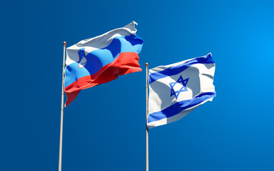 Fototapeta premium Beautiful national state flags of Slovenia and Israel together at the sky background. 3D artwork concept.