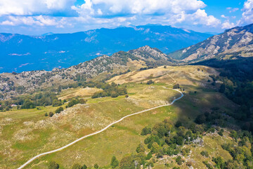 Fototapeta na wymiar Aerial view: Natural landscape and hiking area of ​​the route GR 20 from the Plateau of Coscione, Corsica, France.