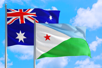 Djibouti and Australia national flag waving in the windy deep blue sky. Diplomacy and international relations concept.