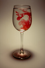 red paint spreads beautifully in the water