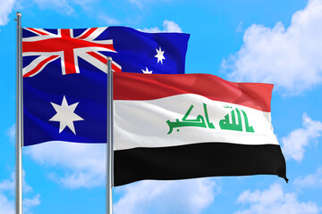 Iraq and Australia national flag waving in the windy deep blue sky. Diplomacy and international relations concept.