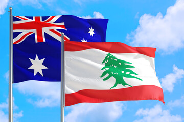 Lebanon and Australia national flag waving in the windy deep blue sky. Diplomacy and international relations concept.