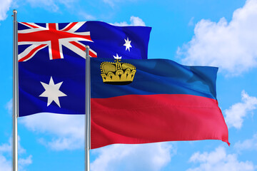 Liechtenstein and Australia national flag waving in the windy deep blue sky. Diplomacy and international relations concept.