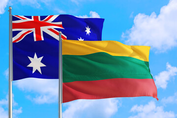 Lithuania and Australia national flag waving in the windy deep blue sky. Diplomacy and international relations concept.