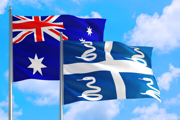 Martinique and Australia national flag waving in the windy deep blue sky. Diplomacy and international relations concept.