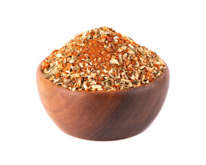 Mix of herbs, spices and dry tomatoes in wooden bowl, isolated on white background. Natural organic food seasoning.