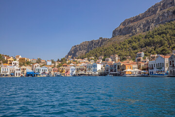 Fototapeta na wymiar Colorful waterfront buildings of the Greek Island Kastellorizo