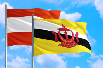 Brunei and Austria national flag waving in the windy deep blue sky. Diplomacy and international relations concept.