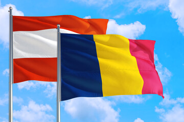 Chad and Austria national flag waving in the windy deep blue sky. Diplomacy and international relations concept.
