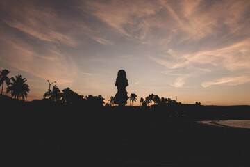 Fototapeta na wymiar Sunset landscape background with woman silhouette