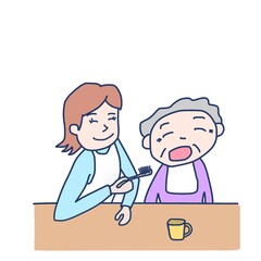 高齢者に歯磨きの介助をしている女性