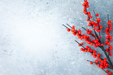 Christmas or New Year background with red winterberry . branches.  Winter holiday concept, top view, copy space