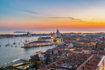Fototapeta na wymiar Aerial view of Venice city rooftops, Sunset over St Mark's square, Venice Italy
