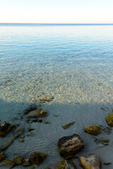 Cristal clear water at Cala Azzurra in Favignana, Italy. The bright blue color of the water gives the name to the place