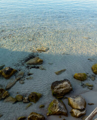 Cristal clear water at Cala Azzurra in Favignana, Italy. The bright blue color of the water gives the name to the place