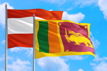 Sri Lanka and Austria national flag waving in the windy deep blue sky. Diplomacy and international relations concept.