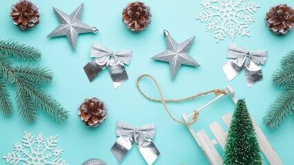 Christmas decorations on blue background with copy space for your text, stop motion animation, 4K - Powered by Adobe