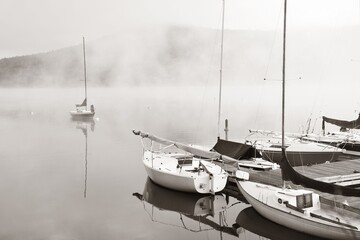 Morning foggy lake boat sunrise