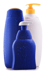 Plastic contaiers of shampoos and shower gels isolated on white