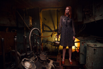 Red-haired girl, in a rusty boat, hungry