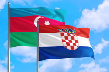 Croatia and Azerbaijan national flag waving in the windy deep blue sky. Diplomacy and international relations concept.