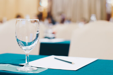 Drinkking water in wine glass on table of meeting room
