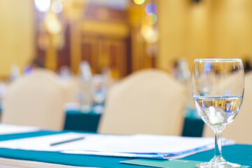 Drinkking water in wine glass on table of meeting room