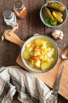 Pickled Cucumber Soup With Vegetables On A Wooden Background