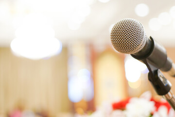 Microphone close up in meeting seminar room blurred background with bokeh