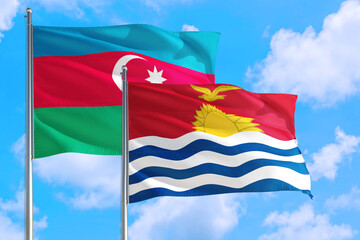 Kiribati and Azerbaijan national flag waving in the windy deep blue sky. Diplomacy and international relations concept.