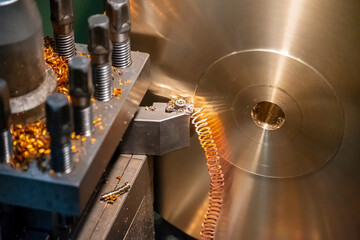 The operation of lathe machine cutting the brass material  parts with the cutting tools. The...
