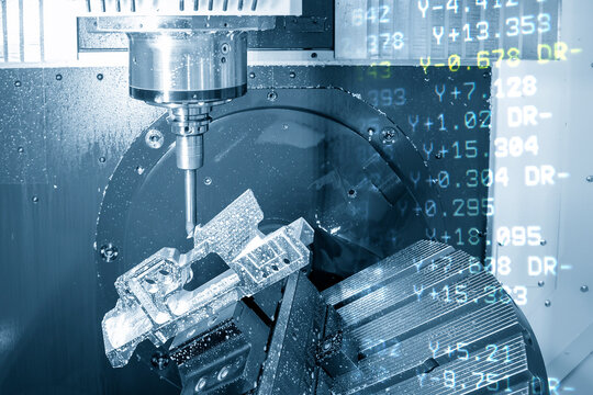 The abstract scene of 5 axis CNC milling machine cutting the aerospace part with the g-code data background. The hi-technology aerospace part manufacturing process by 5 axis CNC milling machine.