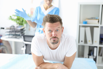 Obraz premium Man in medical office at proctologist. Helping patients with bowel problems concept