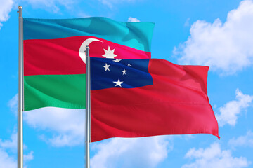 Fototapeta na wymiar Samoa and Azerbaijan national flag waving in the windy deep blue sky. Diplomacy and international relations concept.