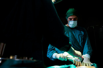Surgeons doctor with assistant  surgery  in operating  room in hospital