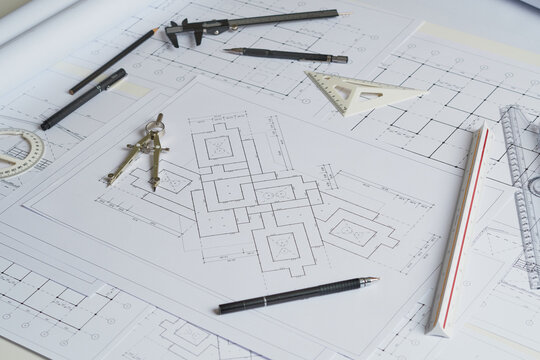 Architect engineer contractor design working drawing sketch plan blueprint and making architectural construction house building in architect studio. © Chaosamran_Studio
