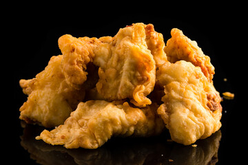wings of fries on a black background