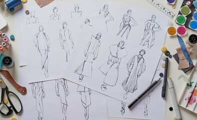 Fashion designer stylish drawings sketches textile fabric material Costume. Designer creative...
