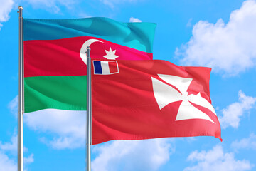 Wallis And Futuna and Azerbaijan national flag waving in the windy deep blue sky. Diplomacy and international relations concept.