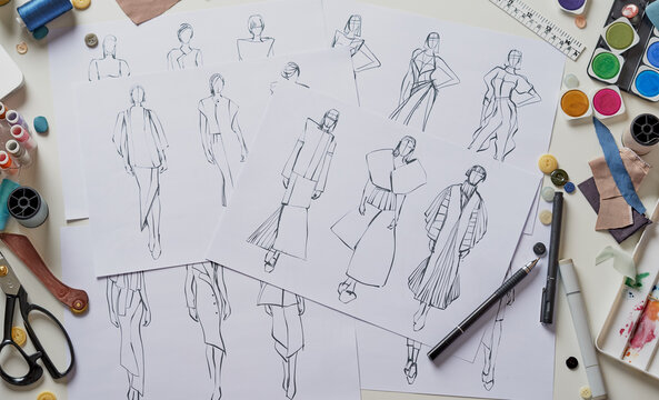 Fashion designer stylish drawings sketches textile fabric material Costume. Designer creative workshop studio.