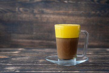 Traditional vietnamese egg coffee made of raw egg yolk and condensed milk, close up