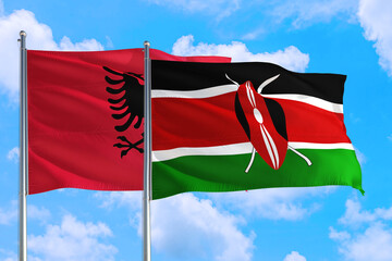 Kenya and Albania national flag waving in the windy deep blue sky. Diplomacy and international...