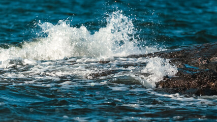 Close up of waves crashing on a rocky shore
