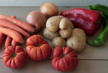 Mixed vegetables on a wooden background. Harvest pick up.